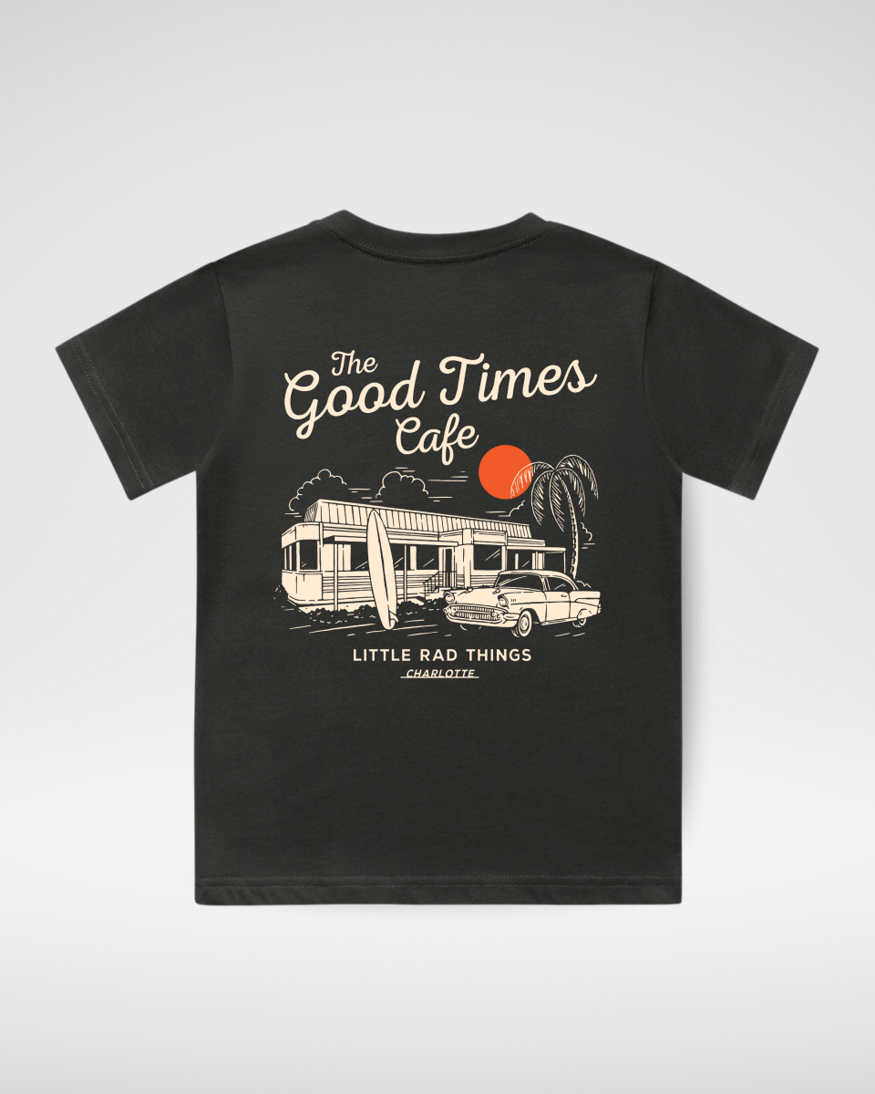 Studio product shot of the charcoal grey kids graphic t-shirt featuring a retro camper van illustration.